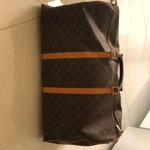 Luis Vuitton large duffle bag in tan and brown.